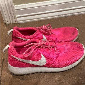 Neon pink nike shoes